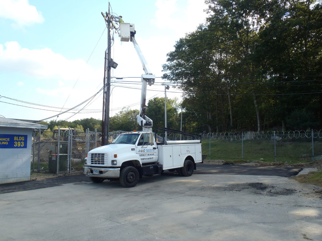 Installing new pole heads at Groton Sub Base